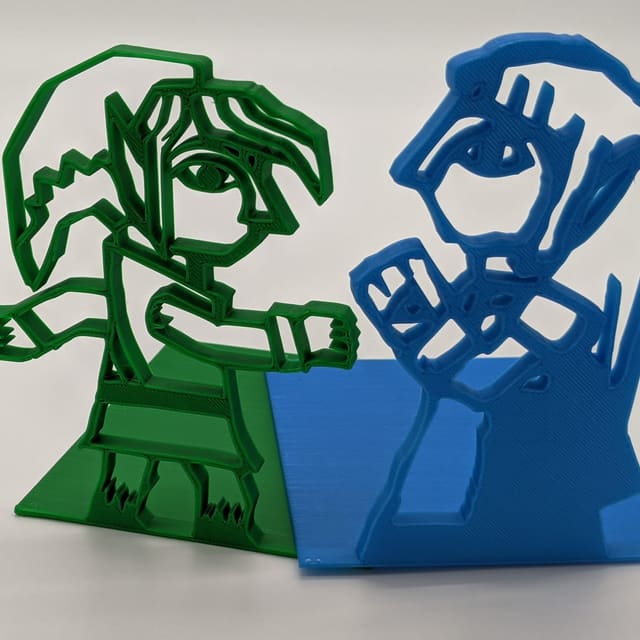 3D-printed bookends: green Link mid-swing and blue Princess Zelda from The Legend of Zelda