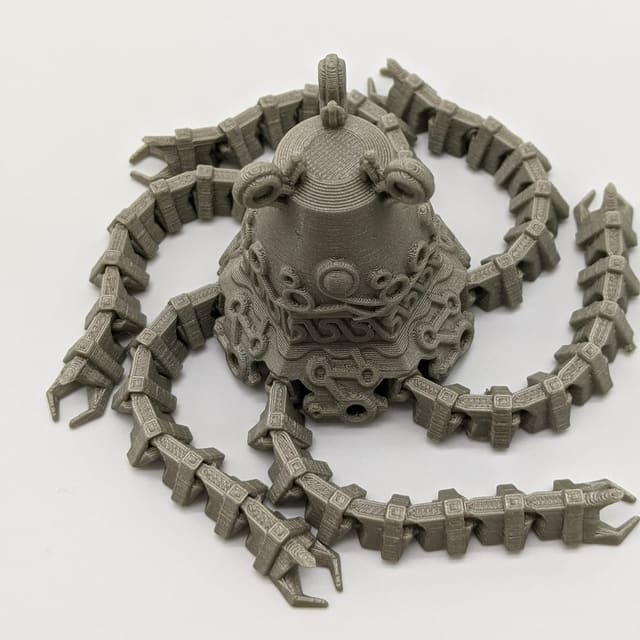 Gray print-in-place articulated kraken with eight poseable arms