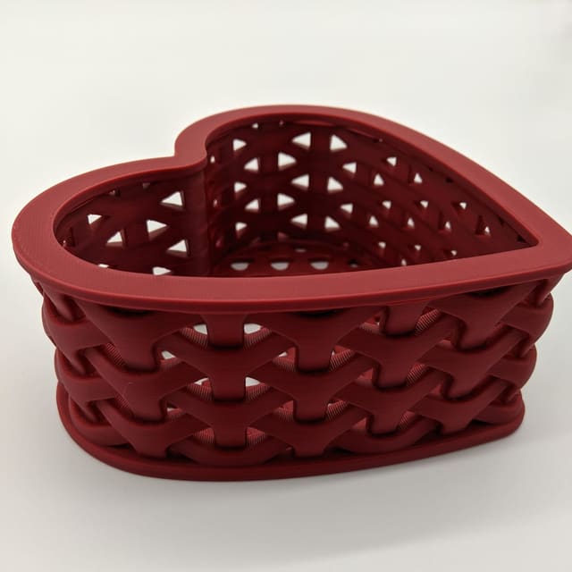 Red heart-shaped 3D-printed basket with a woven-looking texture